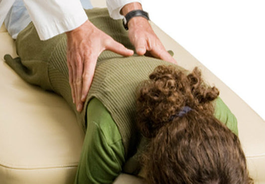 The Value of Experience over Ideology Perception / Reality - Chiropractor adjusting patient